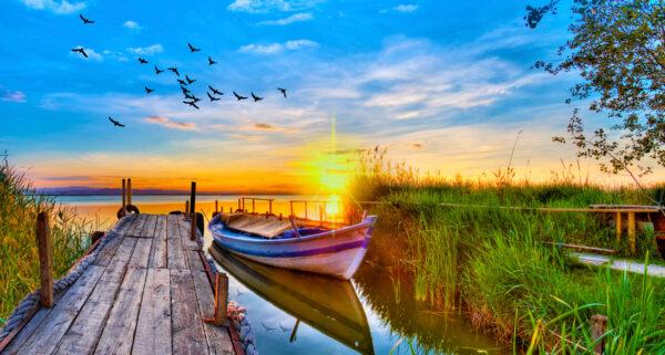 ToF Fotobehang landschap zonsondergang met boot