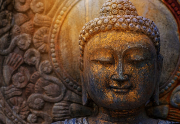 ToF Fotobehang Boeddha beeld op rots met zonlicht