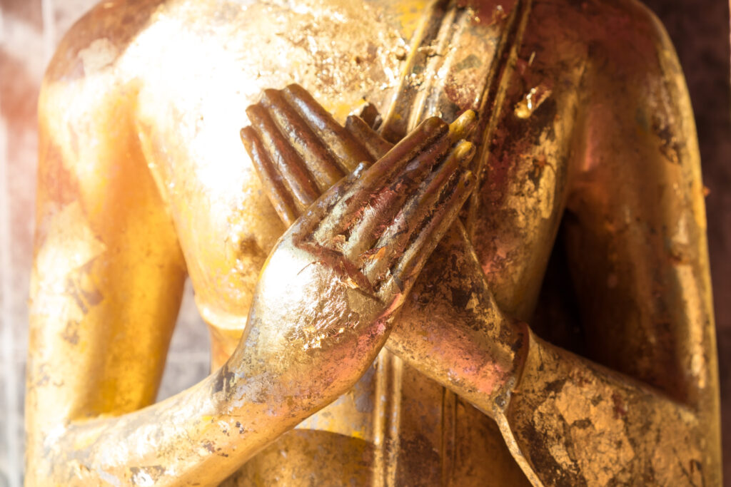 ToF Fotobehang Boeddha standbeeld close-up hand